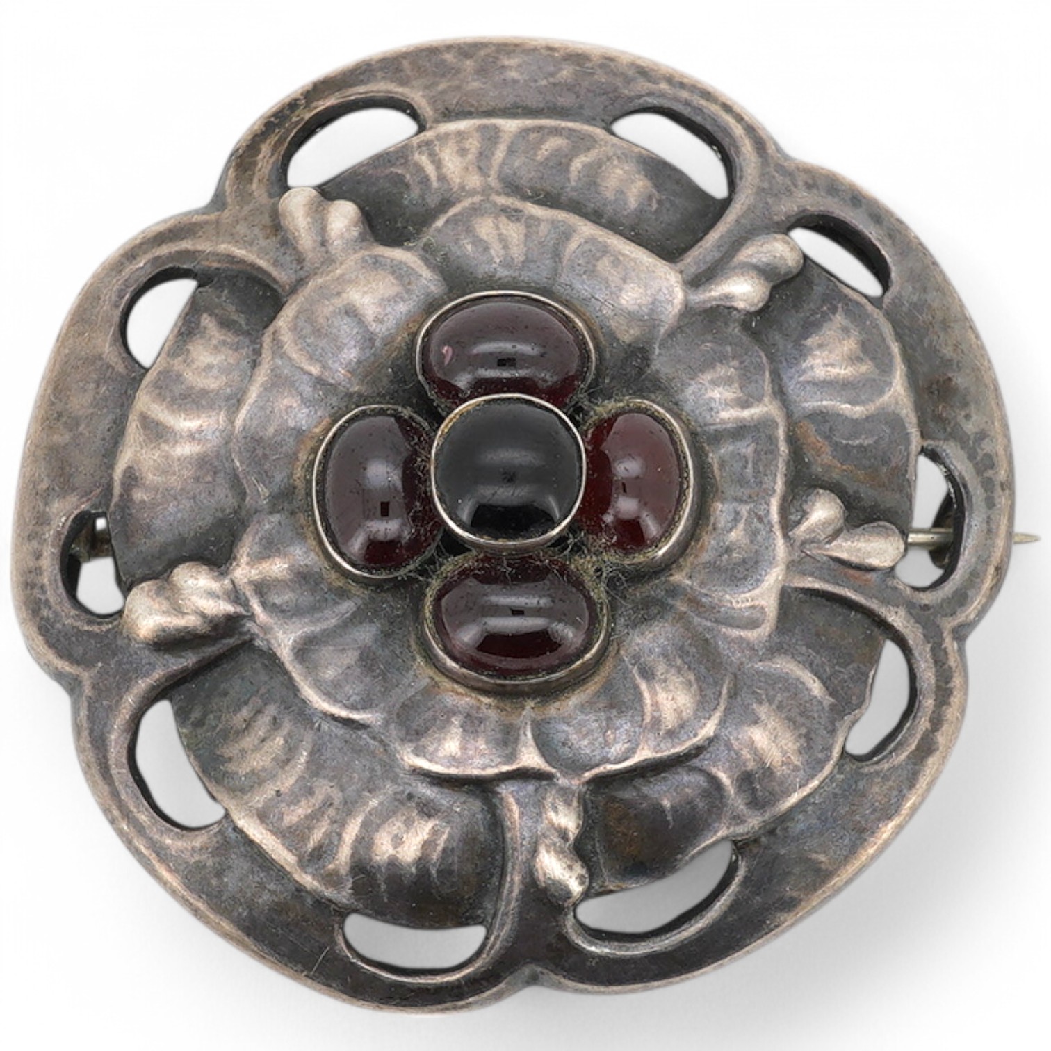 A Danish Georg Jensen sterling 925 and five stone cabochon garnet cluster set circular foliate brooch, design no. 59, 1915-1927 mark, diameter 47mm. Condition - fair to good